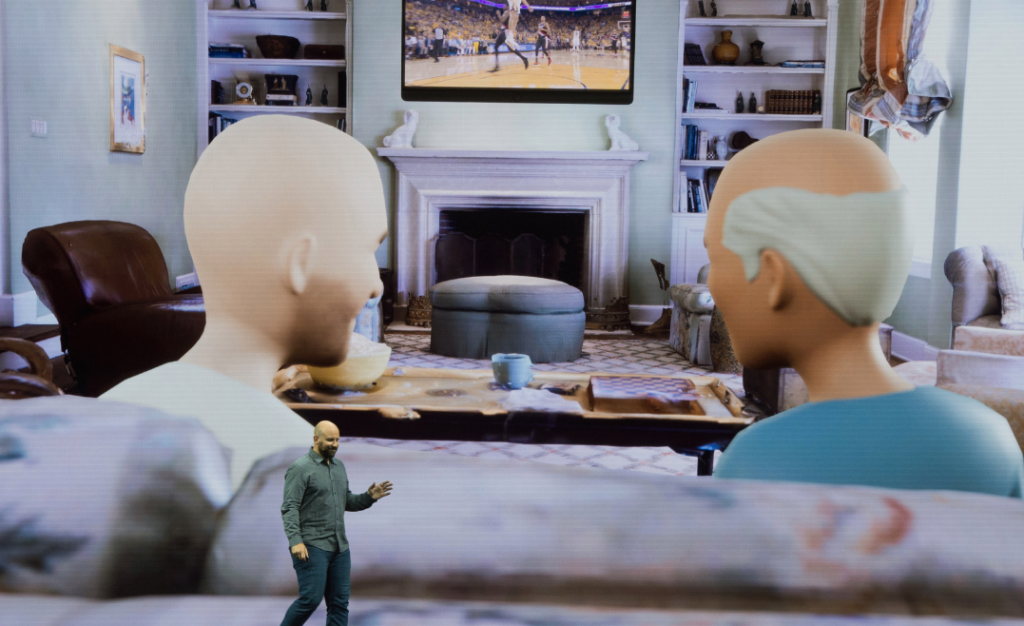 Una presentazione di Meta sul metaverso che mostra una stanza virtuale con due persone che guardano una partita di pallacanestro in televisione. Le definizione è massima