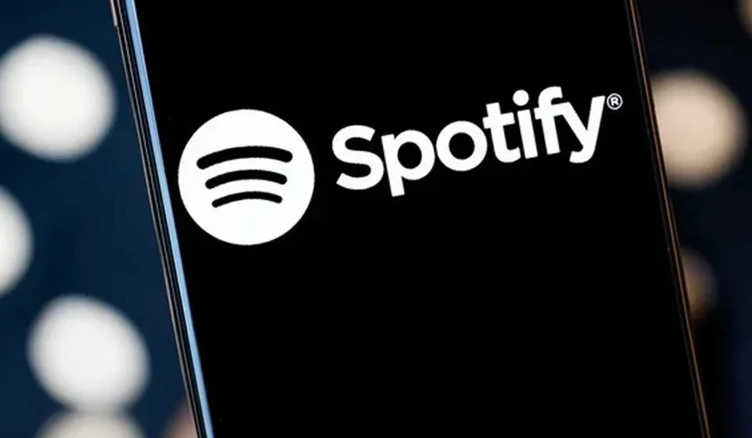 un'immagine di un telefono con il logo di Spotify