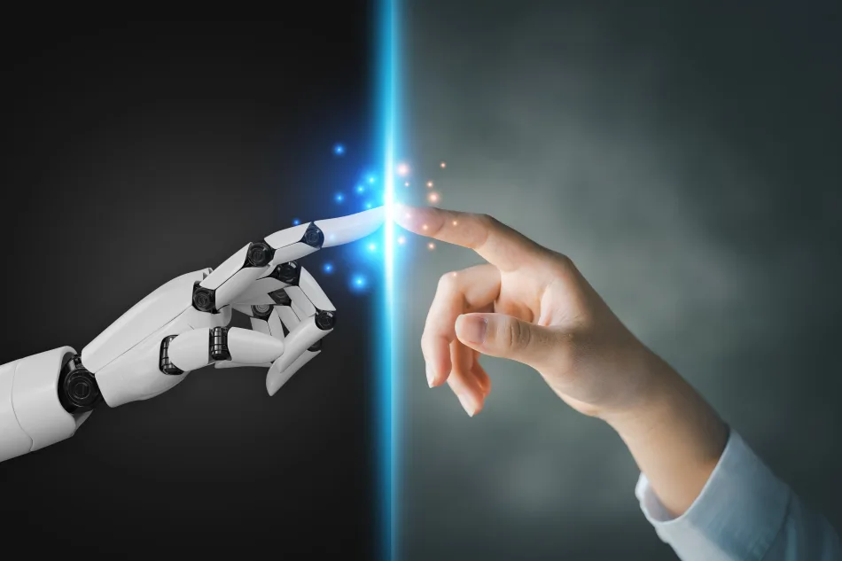 Immagine di una mano umana e una mano robotica che si toccano, creando un effetto di connessione con particelle luminose.