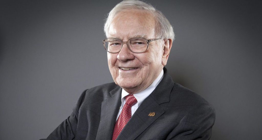 Una fotografia datata di Warren Buffett in giacca e cravatta rossa