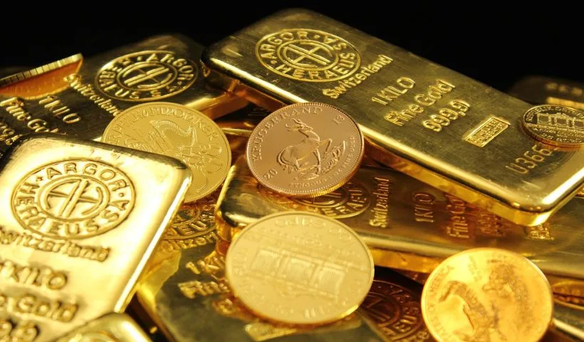 alcuni lingotti e monete d'oro