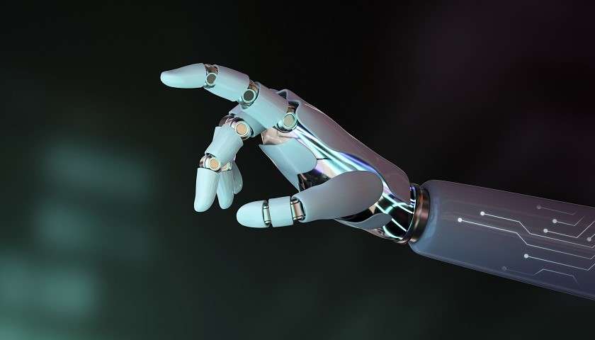 Il dito puntato della mano di un robot